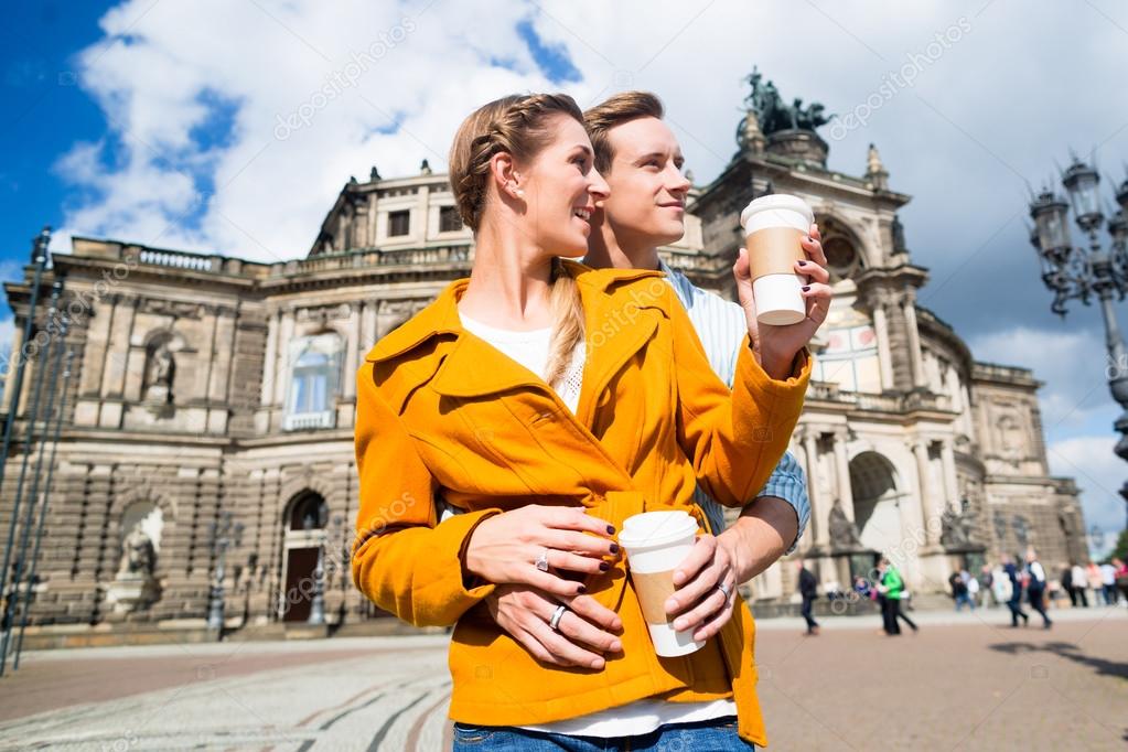 Couple taking walk at Semperoper in Dresden