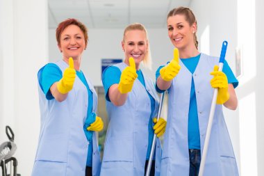 Cleaning ladies working in team