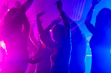 Party people dancing in disco or club clipart