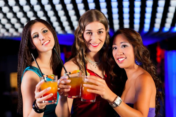 People with cocktails in bar or club — Stock Photo, Image