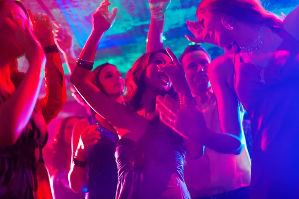 Party people dancing in disco or club — Stock Photo, Image