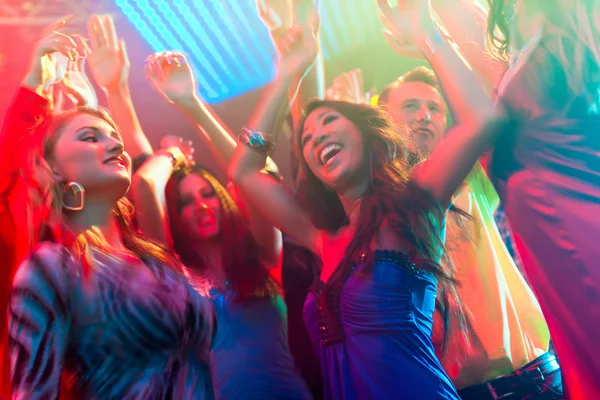 Party people dancing in disco or club — Stock Photo, Image