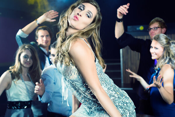 party people dancing in disco or club