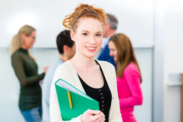 Student with learning group in college — Stock Photo, Image