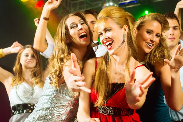 Party people dancing in disco club Stock Photo