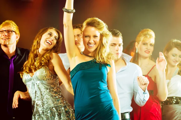 Party people dancing in disco club Stock Image