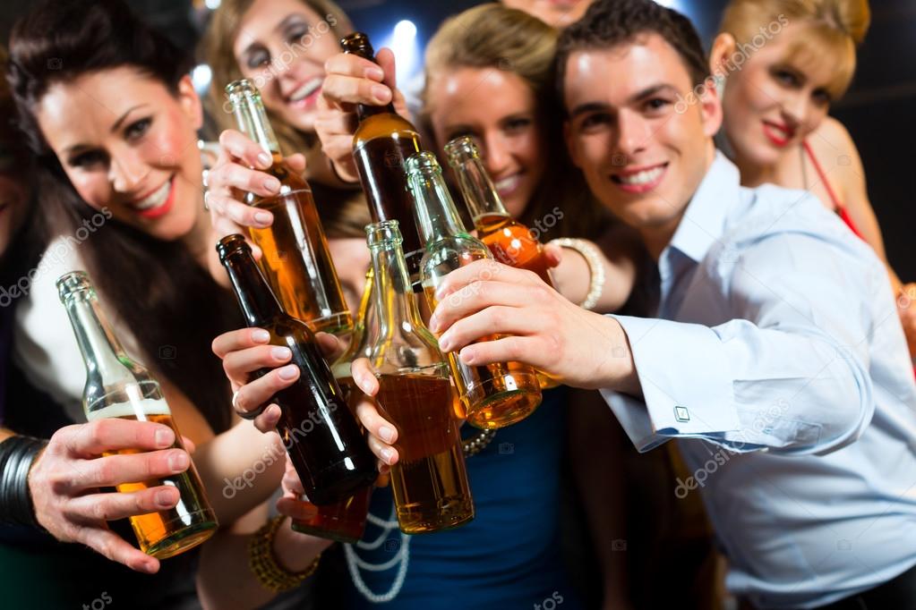People in club or bar drinking beer Stock Photo by ©Kzenon 79225646