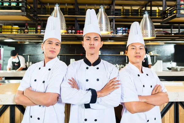 Asian chefs cooking in Restaurant — Stock Photo, Image