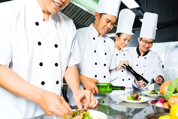 Asian Chef in restaurant kitchen cooking — Stock Photo, Image