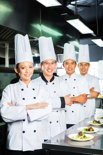 Asian Chef in restaurant kitchen cooking — Stock Photo, Image