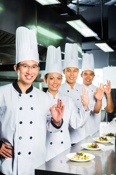 Asian Chef in restaurant kitchen cooking — Stock Photo, Image