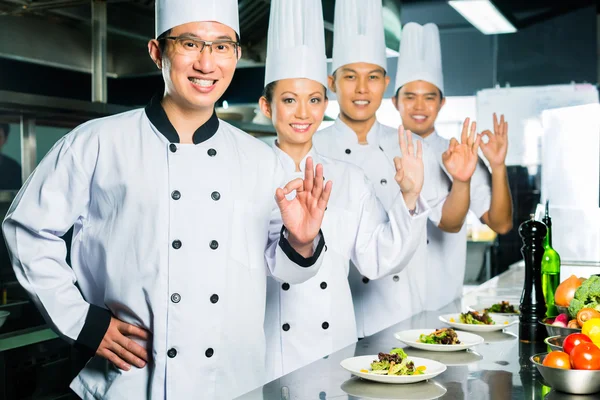 Asian Chef in restaurant kitchen cooking — Stock Photo, Image