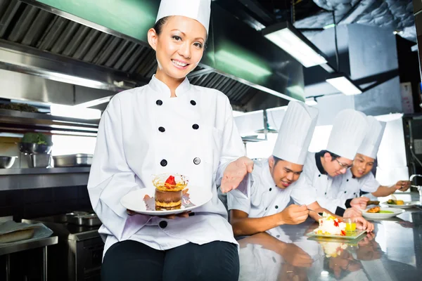 Asian Chef in restaurant kitchen cooking — Stock Photo, Image