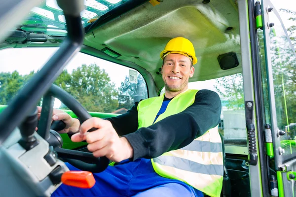 Builder driving construction machinery — 스톡 사진
