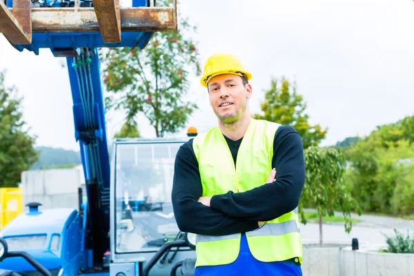 Driver driving construction excavator — Stock Photo, Image