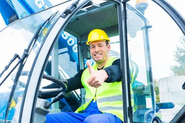 Driver driving construction excavator — Stock Photo, Image