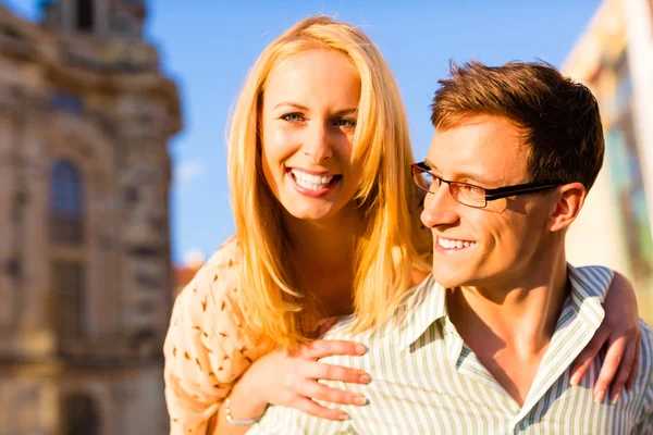 Woman jumping on the back of a man — Stock Photo, Image