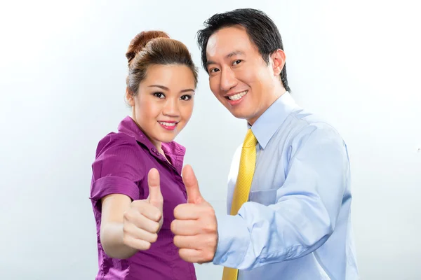 Motivated colleagues in Asian business office — Stock Photo, Image