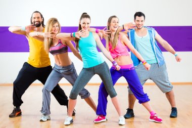 Dancer at Zumba fitness training in dance studio clipart