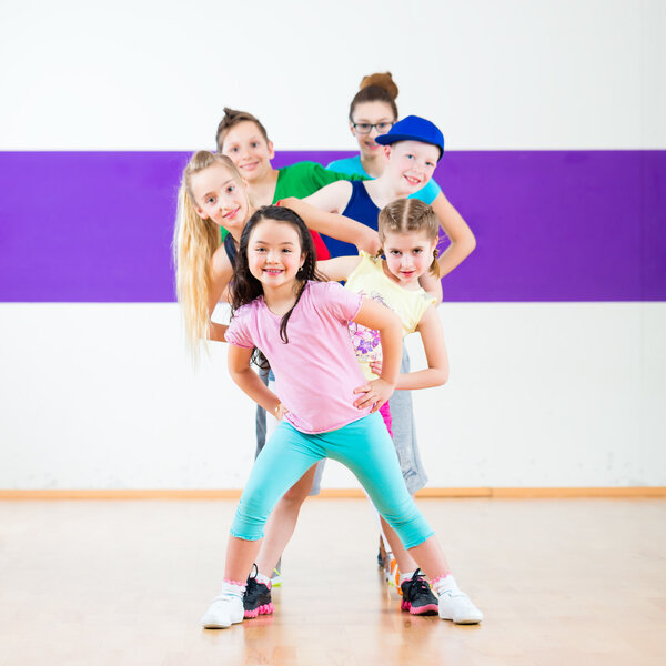 Kids train Zumba fitness in dancing school 