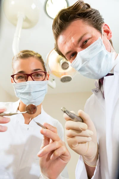 Treatment at dentist from perspective of patient — Stock Photo, Image