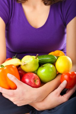 Healthy nutrition - young woman with fruits clipart