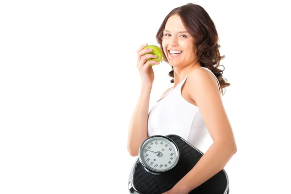 Kvinna med skala under hennes arm och apple — Stockfoto