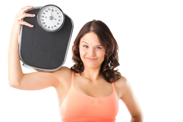 Young woman with measuring scale — Stock Photo, Image