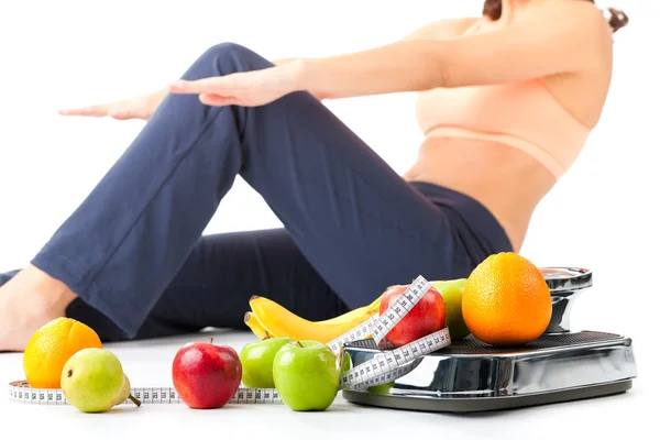 Diet and sport - woman is doing sit-ups Stock Picture