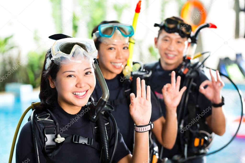 People in diving school, students and master