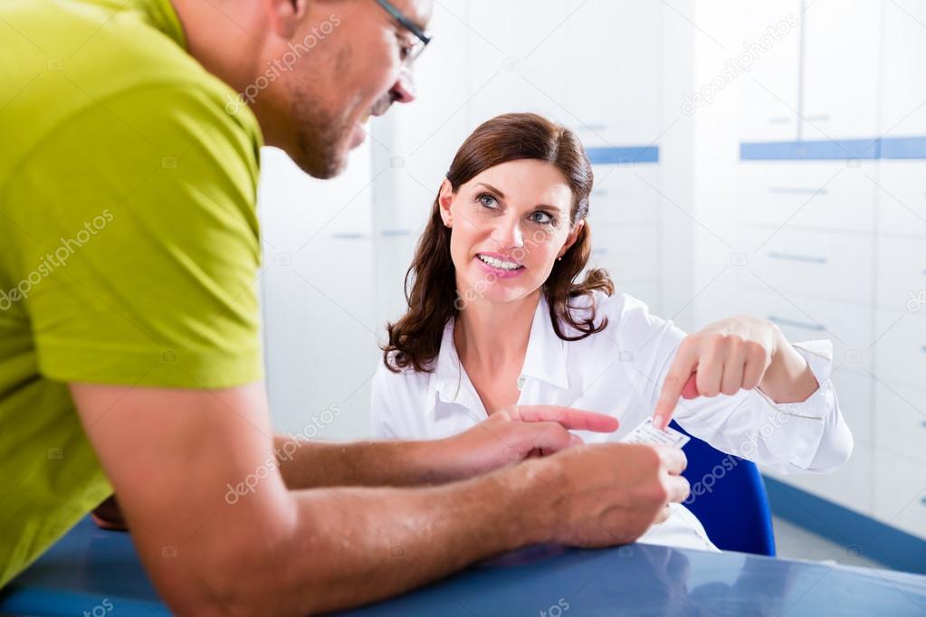 Patient at reception of doctors office 