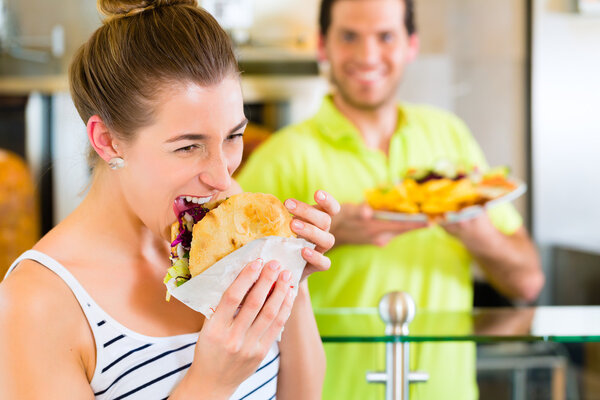 Kebab - customer and hot Doner with fresh ingredients