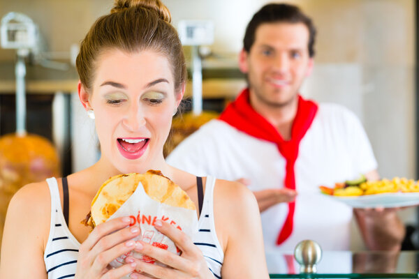 Kebab - customer and hot Doner with fresh ingredients