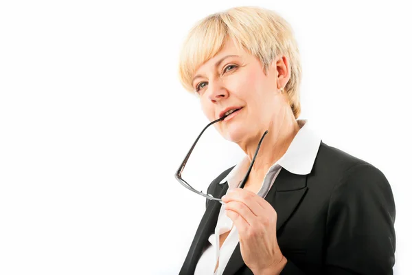 Mature woman playing with her glasses — Stock Photo, Image