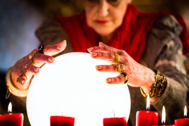 Soothsayer during a Seance or session with Crystal ball clipart
