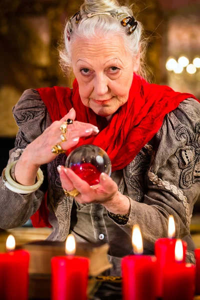 Soothsayer during session with crystal ball — Stock Photo, Image