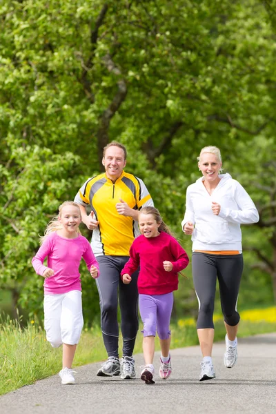 Family jogging for sport outdoors — Stock Photo, Image