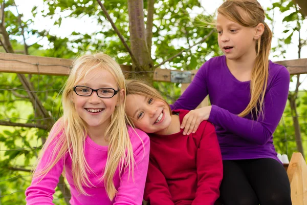 Happy children in the garden and laugh — Stock Photo, Image