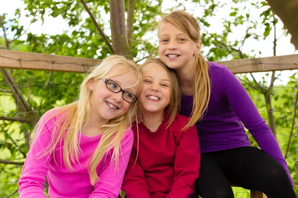 Happy children in the garden and laugh — Stock Photo, Image