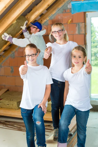 Engineer and daughters building top floor — Stock Photo, Image