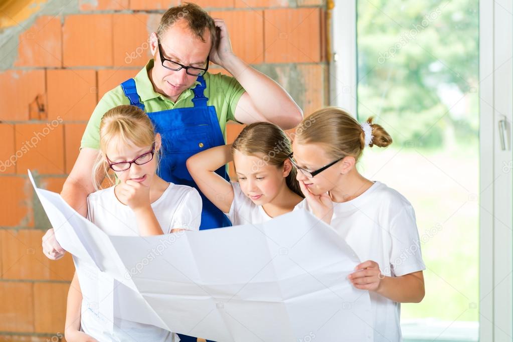 Familiy viewing home contruction site