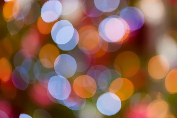 Christmas baubles on tree - Bokeh — Stock Photo, Image