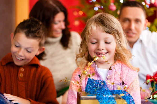 Christmas - family with gifts on Xmas Eve — Stock Photo, Image