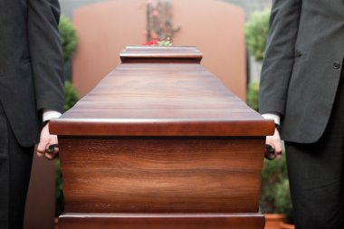coffin bearer carrying casket at funeral clipart