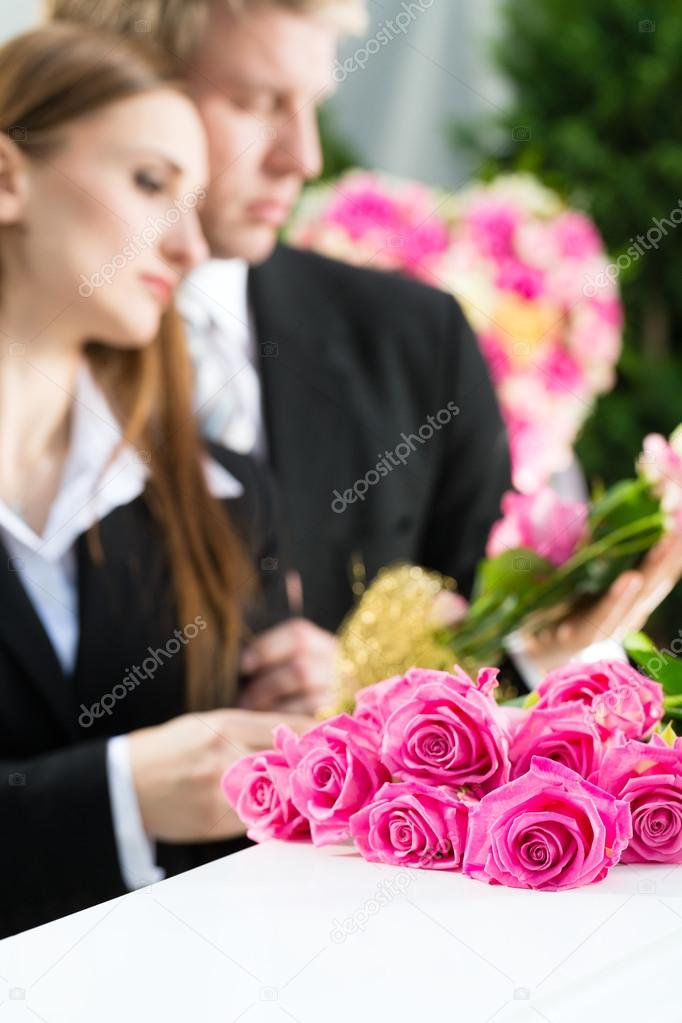 Mourning People at Funeral with coffin