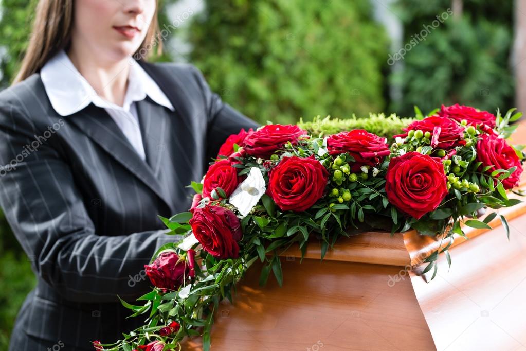 Mourning Woman at Funeral with coffin — Stock Photo © Kzenon #79660138