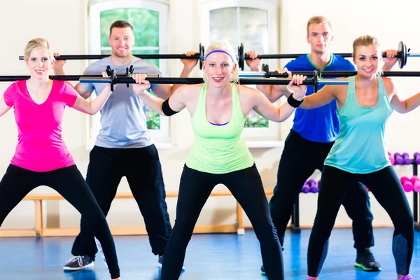 Weight training in the gym with dumbbells — Stock Photo, Image