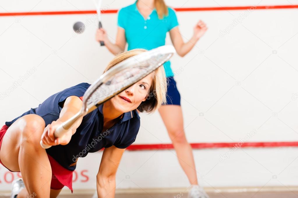 Squash racket sport in gym, women competition — Stock Photo © Kzenon