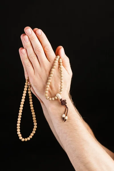 Mano pregando con catena — Foto Stock