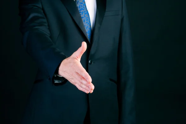 Business man in suit offering handshake — Stock Photo, Image